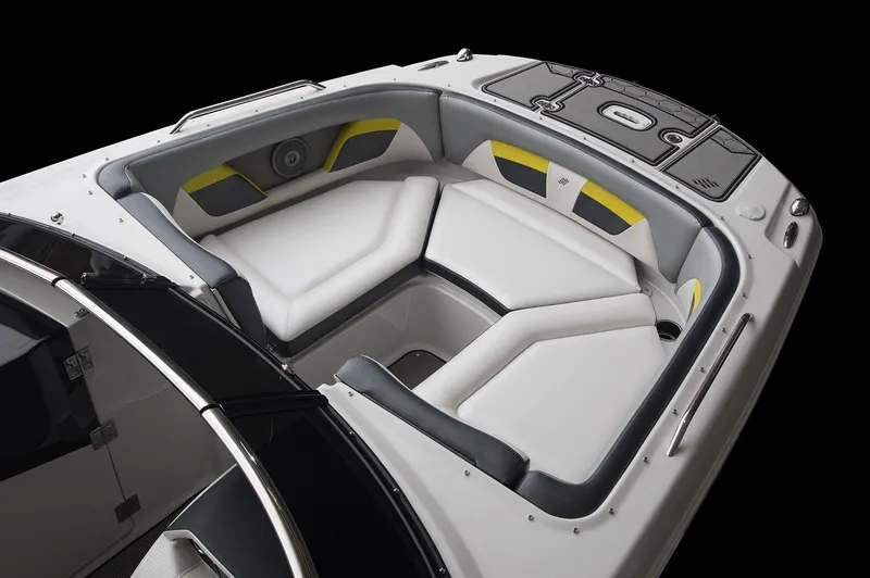 Slide: The Image of 2017 Four Winns HD220 RS boat interior with white and gray seating, stored indoors. - 9