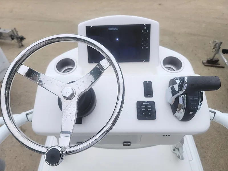Slide: The Image of Steering console of a 2017 SeaVee 270Z boat with controls and display. - 14