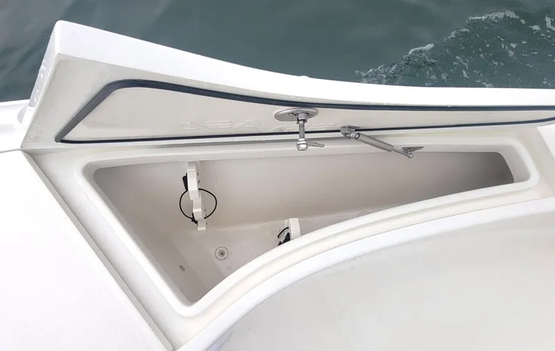 Slide: The Image of Open storage compartment on 2017 SeaVee 270Z boat, showing interior details. - 9