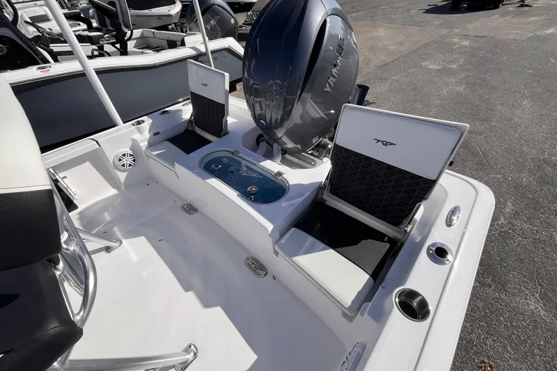 Slide: The Image of 2026 Tidewater 2110 Bay Max boat interior with Yamaha engine and seating area. - 13