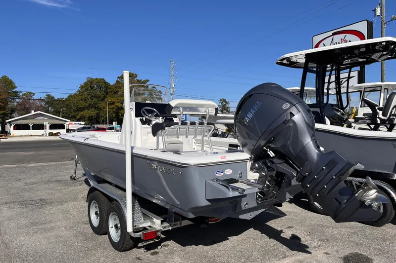 Slide: The Image of 2026 Tidewater 2110 Bay Max boat with Yamaha outboard motor on trailer. - 2