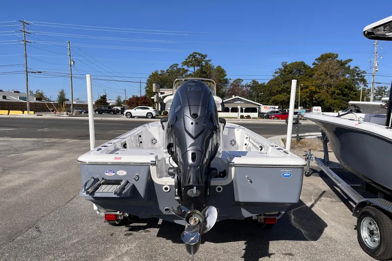 Slide: The Image of 2026 Tidewater 2110 Bay Max boat with outboard motor in parking lot. - 3