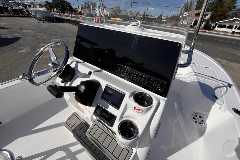 Slide: The Image of 2026 Tidewater 2110 Bay Max boat console with steering wheel and controls. - 7