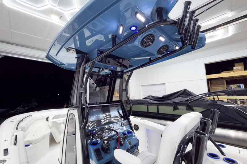 Slide: The Image of 2026 Tidewater 272 CC Adventure boat interior with modern console and seating. - 14