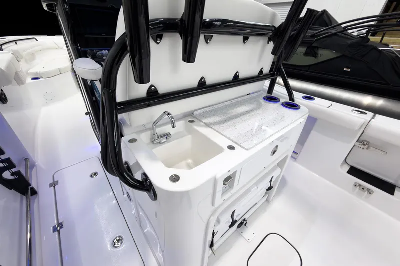 Slide: The Image of 2026 Tidewater 272 CC Adventure boat interior with sink and storage area. - 29