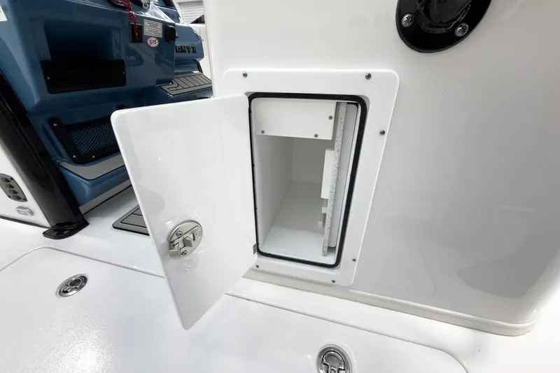 Slide: The Image of Open storage compartment on 2026 Tidewater 272 CC Adventure boat. - 32