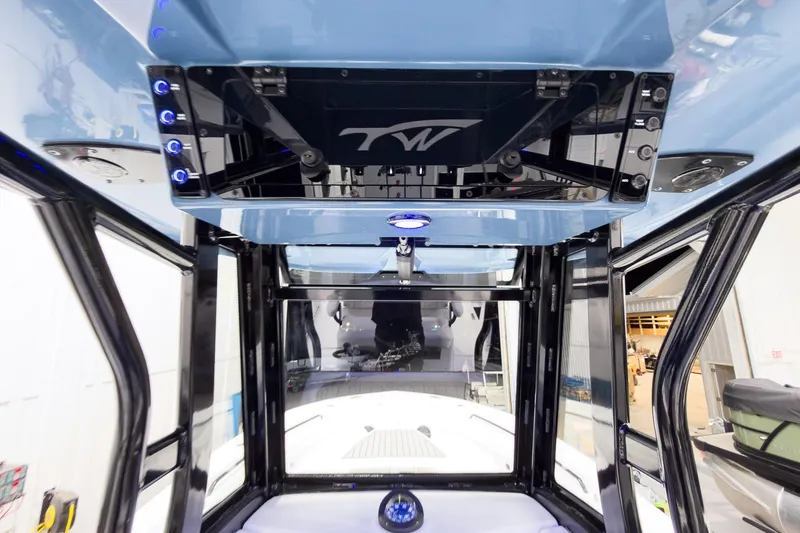 Slide: The Image of Interior view of 2026 Tidewater 272 CC Adventure boat, showcasing modern design and controls. - 36