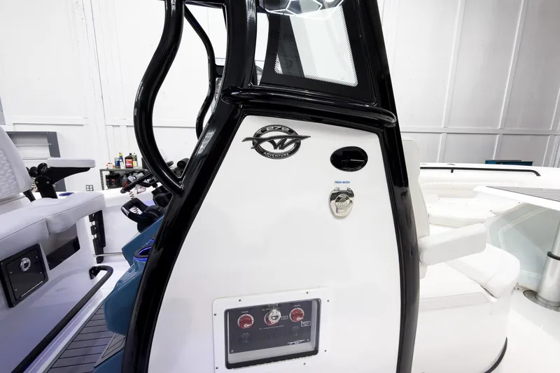 Slide: The Image of 2026 Tidewater 272 CC Adventure boat interior with control panel and seating. - 37