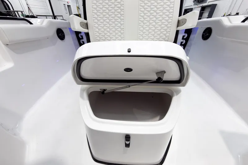 Slide: The Image of 2026 Tidewater 272 CC Adventure boat storage compartment with cushioned seating. - 49