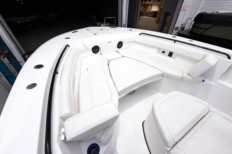 Slide: The Image of 2026 Tidewater 272 CC Adventure boat interior with white seating and modern design. - 50