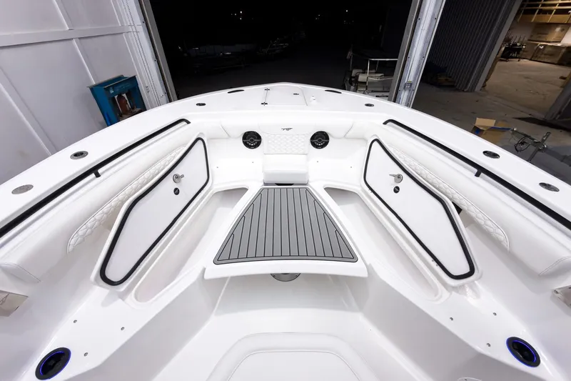 Slide: The Image of 2026 Tidewater 272 CC Adventure boat interior with spacious seating and storage compartments. - 52