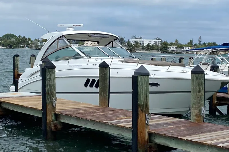 The Image of 2013 Cruisers Yachts 380 Express docked by the waterfront. - 0