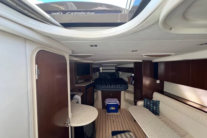 Slide: The Image of Interior of 2013 Cruisers Yachts 380 Express, featuring cozy seating and modern amenities. - 17