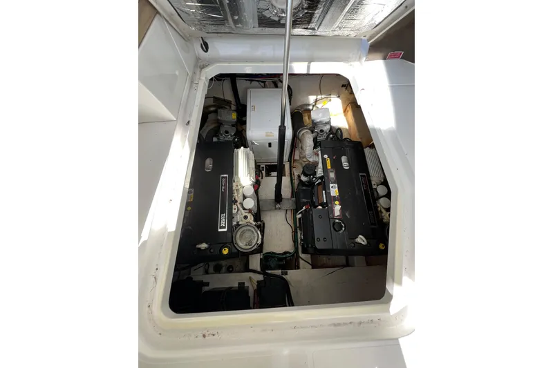 Slide: The Image of Engine compartment of a 2013 Cruisers Yachts 380 Express, showcasing dual engines. - 23
