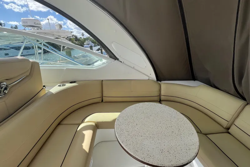 Slide: The Image of Luxurious interior of 2013 Cruisers Yachts 380 Express with beige seating and round table. - 6