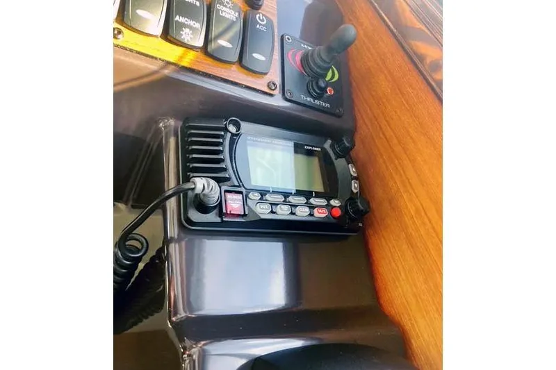 Slide: The Image of Control panel of 2021 Ranger Tugs R-25 with radio and thruster controls. - 27