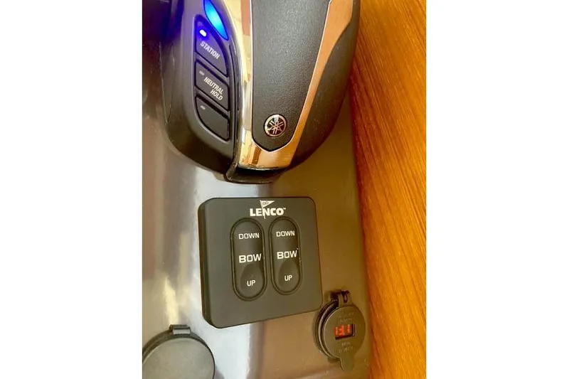 Slide: The Image of Control panel of 2021 Ranger Tugs R-25 boat with Lenco trim tab switches. - 35