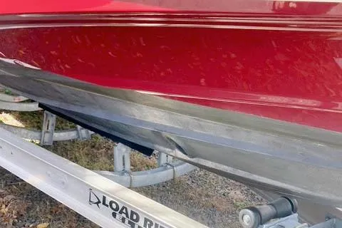 Slide: The Image of 2021 Ranger Tugs R-25 boat on Load Rite trailer, red hull detail. - 9