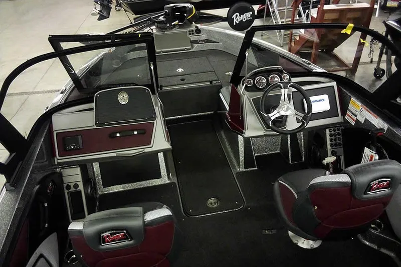 Slide: The Image of 2026 Ranger 1850MS Reata boat interior with steering wheel and dashboard controls. - 11