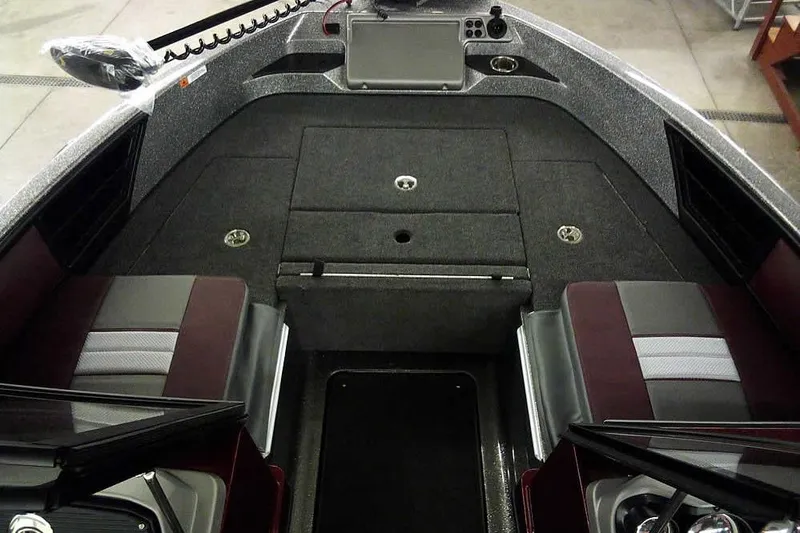 Slide: The Image of 2026 Ranger 1850MS Reata boat interior with seating and storage compartments. - 13