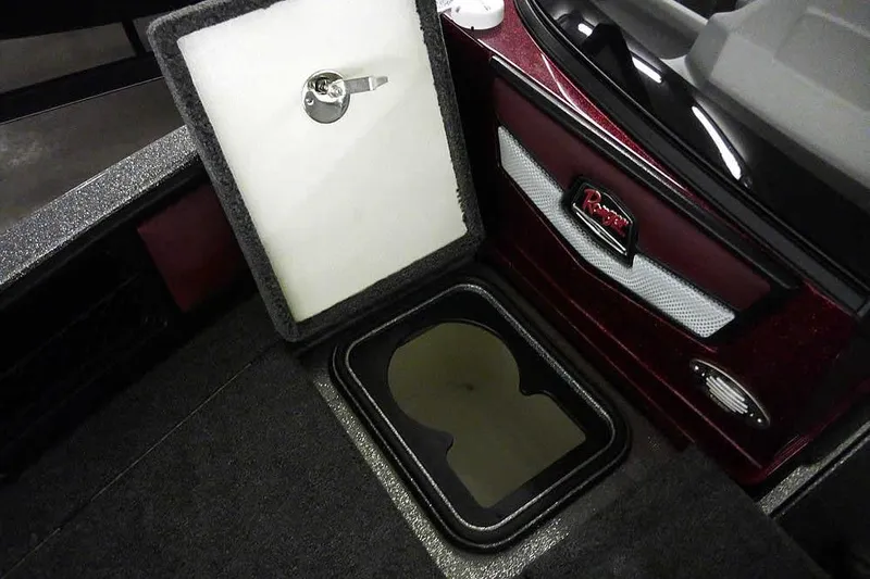 Slide: The Image of 2026 Ranger 1850MS Reata boat interior storage compartment with open lid and sleek design. - 15