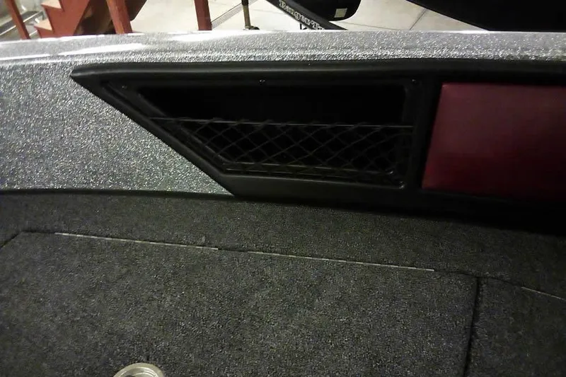 Slide: The Image of Interior view of 2026 Ranger 1850MS Reata boat with storage compartment. - 17