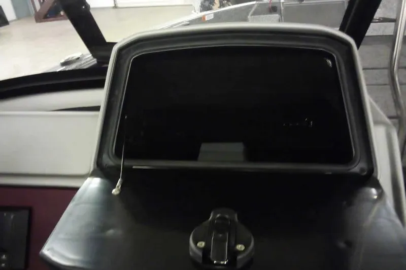 Slide: The Image of Dashboard of 2026 Ranger 1850MS Reata boat with closed compartment. - 28