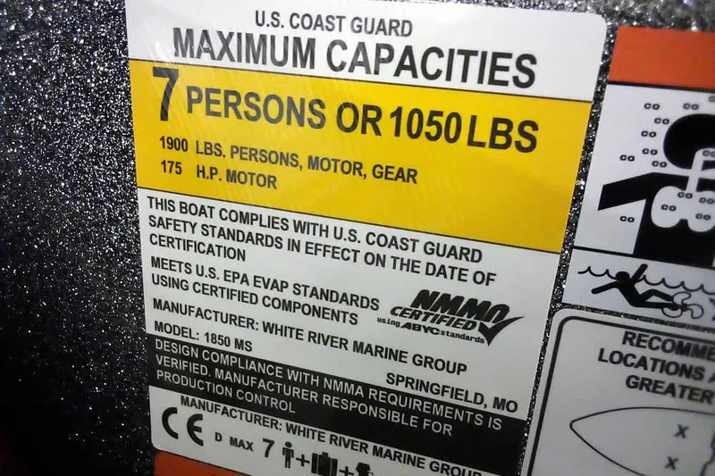 Slide: The Image of 2026 Ranger 1850MS Reata boat capacity label, 7 persons or 1050 lbs, 175 HP motor. - 30