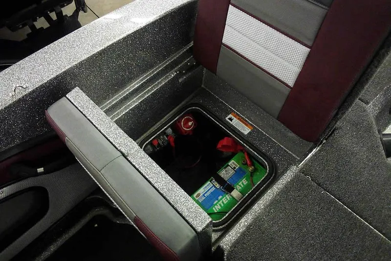 Slide: The Image of 2026 Ranger 1850MS Reata boat interior with battery compartment open. - 39