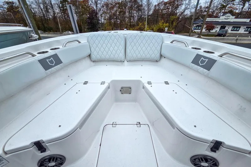 Slide: The Image of 2026 Sea Fox 228 Commander boat interior with white seating and storage compartments. - 12