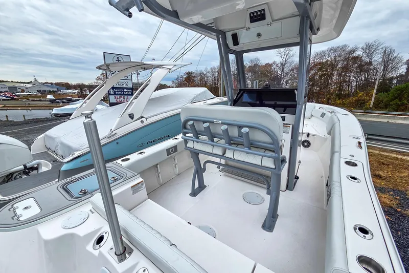 Slide: The Image of 2026 Sea Fox 228 Commander boat interior with seating and control panel, displayed outdoors. - 5