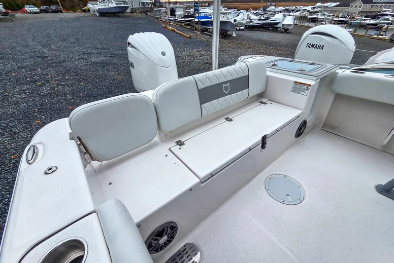 Slide: The Image of 2026 Sea Fox 228 Commander boat interior with Yamaha engines, featuring seating and storage. - 6