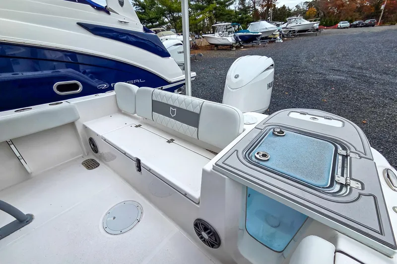 Slide: The Image of 2026 Sea Fox 228 Commander boat interior with seating and storage compartments. - 7
