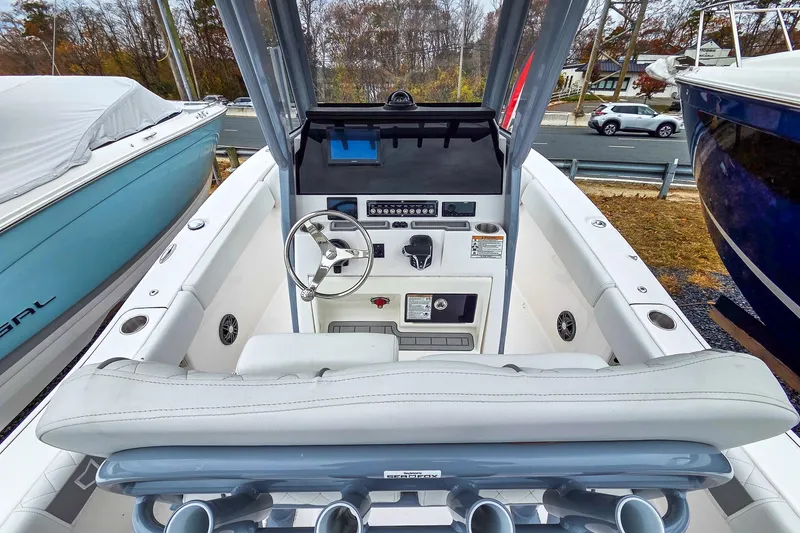 Slide: The Image of 2026 Sea Fox 228 Commander boat cockpit with steering wheel and control panel. - 8