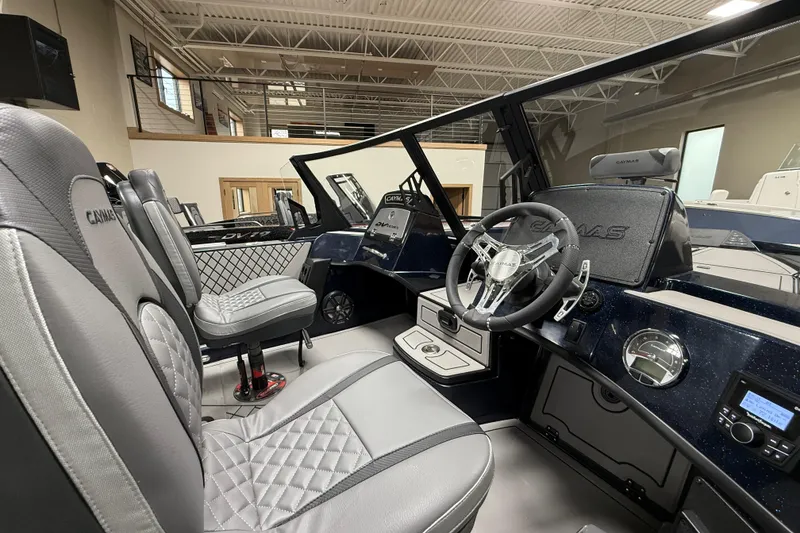 Slide: The Image of Interior of 2026 Caymas DV 22 boat with modern steering and luxurious seating. - 10