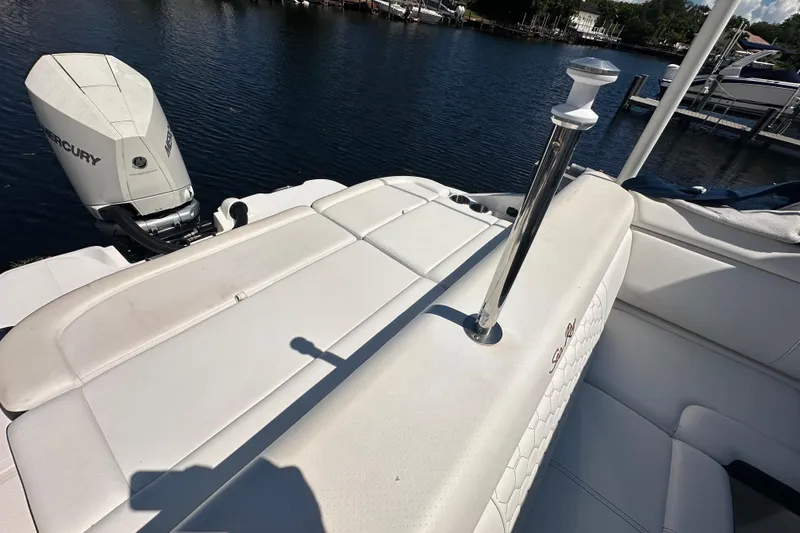 Slide: The Image of 2019 Sea Ray SDX 270 Outboard boat with white seating and Mercury engine. - 6