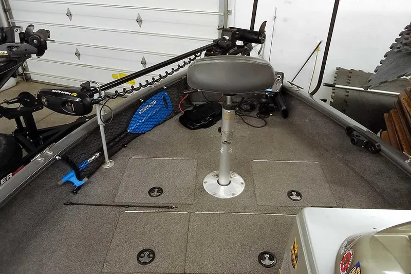 Slide: The Image of 2018 Tracker Pro Guide V-16 SC boat interior with fishing equipment and seating. - 10