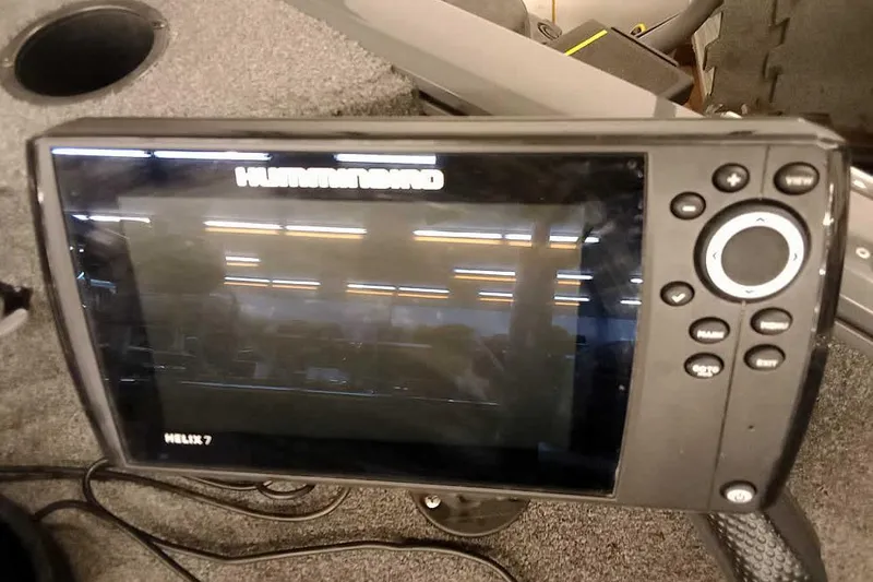 Slide: The Image of Humminbird Helix 7 fish finder on 2018 Tracker Pro Guide V-16 SC boat. - 11
