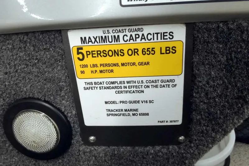 Slide: The Image of 2018 Tracker Pro Guide V-16 SC capacity label, 5 persons or 655 lbs, U.S. Coast Guard compliant. - 20