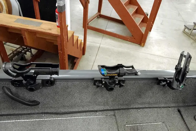 Slide: The Image of 2018 Tracker Pro Guide V-16 SC boat with mounted fishing rod holders. - 21