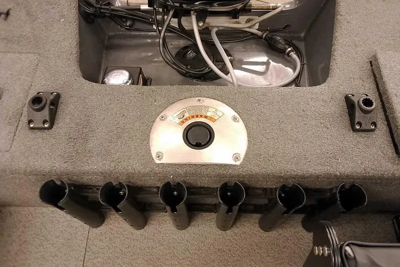 Slide: The Image of 2018 Tracker Pro Guide V-16 SC boat interior with rod holders and wiring. - 24