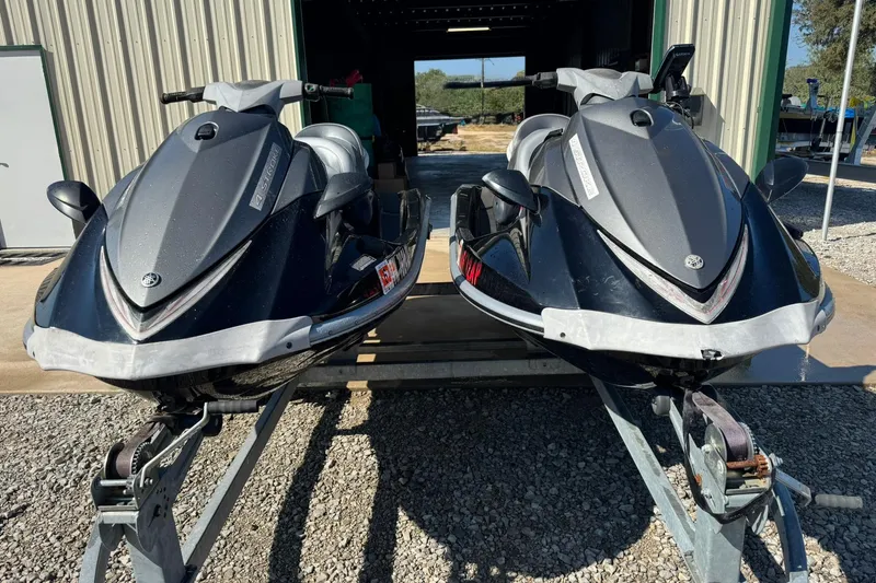 Slide: The Image of Two 2007 Yamaha WaveRunner VX Cruisers on trailers outside a storage facility. - 4