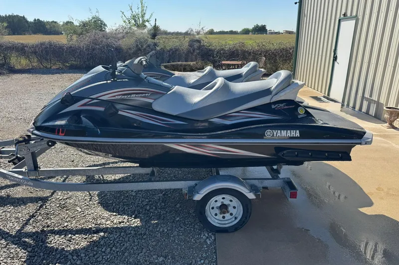 Slide: The Image of 2007 Yamaha WaveRunner VX Cruiser on trailer, parked outdoors near a building. - 6