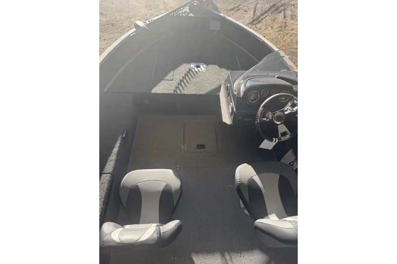 Slide: The Image of 2026 Lowe Fishing Machine 1625SC interior with dual seats and steering console. - 19