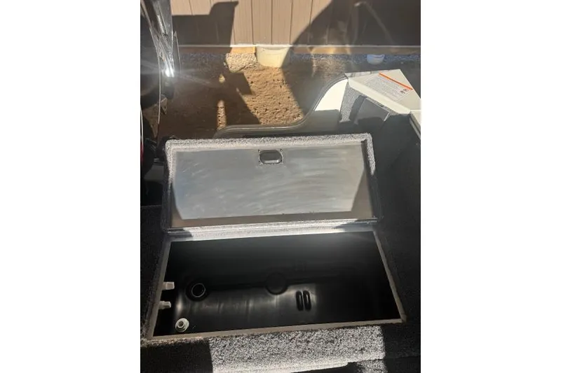 Slide: The Image of 2026 Lowe Fishing Machine 1625SC livewell compartment open, showcasing interior details. - 20