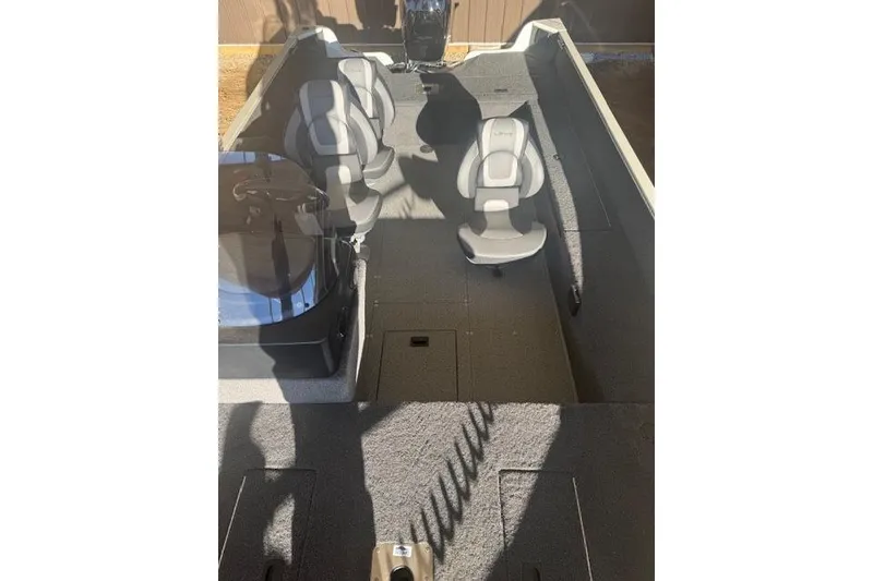 Slide: The Image of 2026 Lowe Fishing Machine 1625SC interior with seating and console. - 28