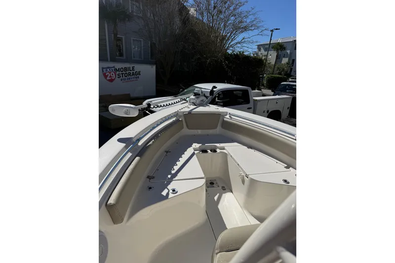 Slide: The Image of 2021 Key West 239 FS boat interior with storage compartments and seating. - 13