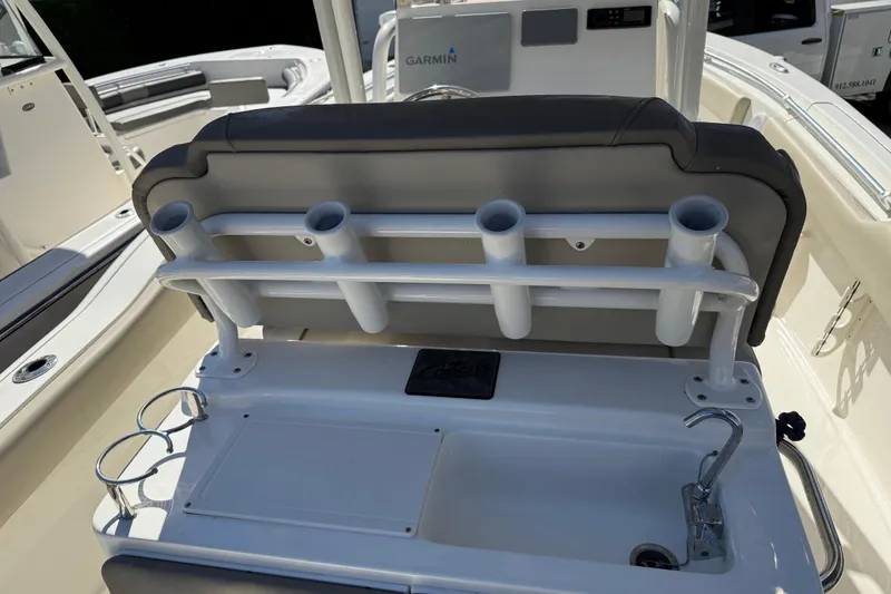 Slide: The Image of 2021 Key West 239 FS boat interior with rod holders and sink. - 15