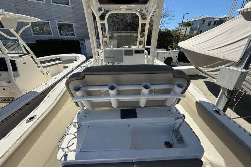Slide: The Image of 2021 Key West 239 FS boat interior with rod holders and sink station. - 16