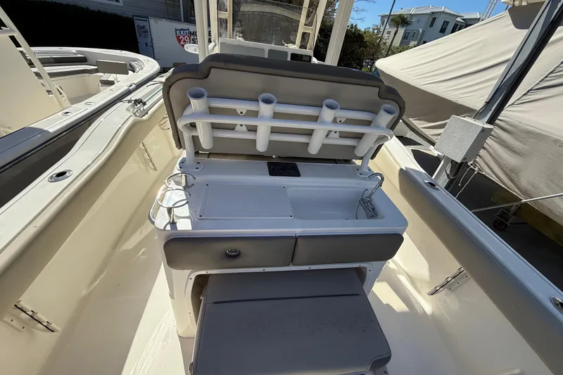 Slide: The Image of 2021 Key West 239 FS boat interior with rod holders and storage compartments. - 19
